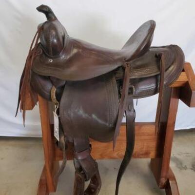 248	

Ole Custom Cowboy Saddle
16" Ole Custom Cowboy Saddle. 5" pencil roll cantle. This is a nice collector saddle. Can't...