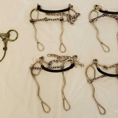 383	

5 Misc Bit Lot
1- English Training Bit with Nose Training Band

4- Combination Long Shank Hackamore Gag Bits with Twisted Wire...