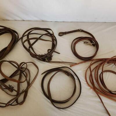 410	

Lot of Cowboy Roping and Split Leather Reins
Lot of Cowboy Roping and Split Leather Reins