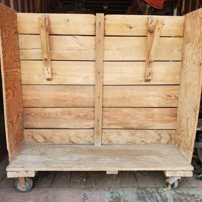 309	

Harness Holding Cart on wheels
Wooden Harness Holding Cart on wheels
Size is 24"x54"x55"
Hooks for collars and harness