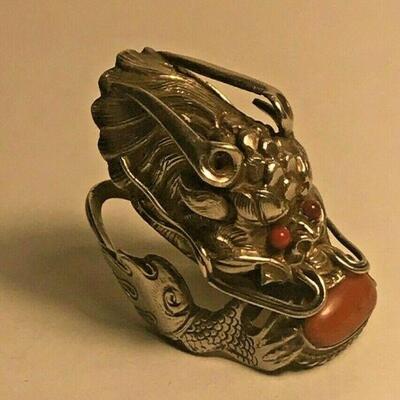 https://www.ebay.com/itm/124403121193	WL141 VINTAGE UNMARKED STERLING SILVER DRAGON RING WITH RED STONE		 Auction 
