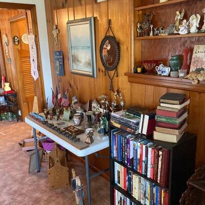 Table full of carvings, vintage trophies & more