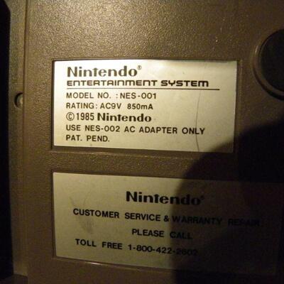" Nintendo NES-001 with games".