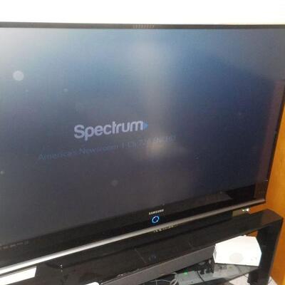 60 inch Samsung TV with stand".