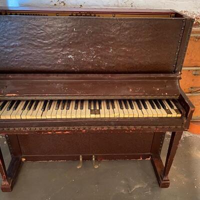 Leather-covered speakeasy piano.  Only 44 inches wide, 40 inches high, 22 inches deep from front to back.  The keyboard is 36 inches...