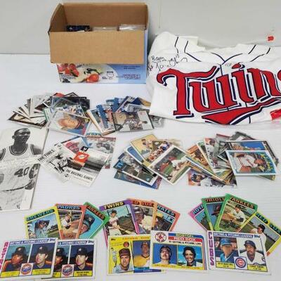 1414	

Baseball Cards, and Jersey Appears To Be Signed
Baseball Cards, and Jersey Appears To Be Signed