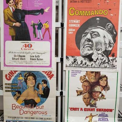 1218	

4 Vintage Movie Posters
Includes Cast A Giant Shadow, Beautiful But Dangerous, Commando, And 40 Carats
 	 