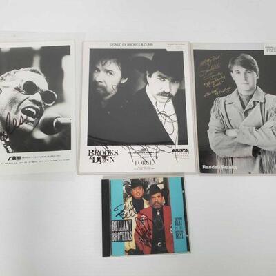 1320	

Signed Photos of Ray Charles, Brooks & Dunn, Randall Franks and Signed Bellamy Brothers CD
All appear to be signed, not...