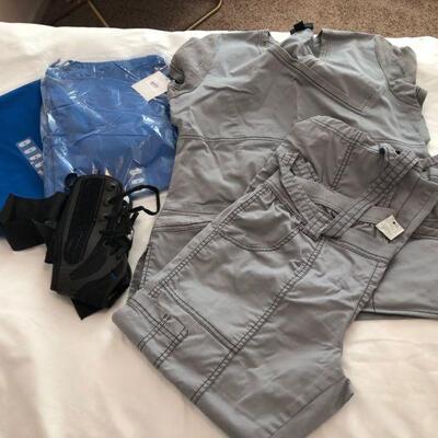 Size M scrubs and two extra size S scrub bottoms and an ankle brace. 