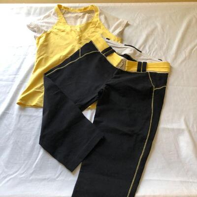 Bebe Sport workout outfit with short sleeve shirt and crop pants. 