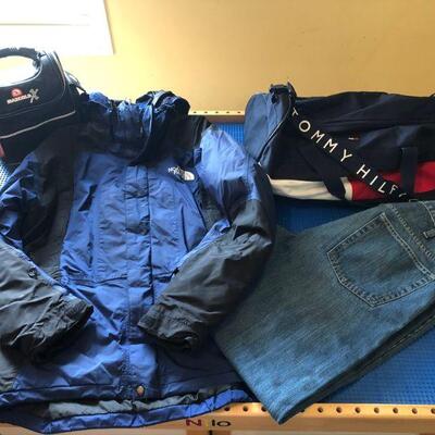 North Face Men's jacket with zip out fleece, a Tommy Hilfiger duffel bag and a pair of men's GAP jeans size 36 x 34.