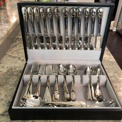 Waterford stainless silverware in wood box. 