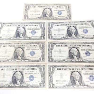 1560	

7 Blue Seal Dollar Bills
4 1957 3 1957 A