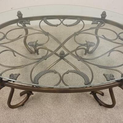 1014	WROUGHT IRON & GLASS OVAL COFFEE TABLE, 52 IN X 33 IN X 19 IN HIGH
