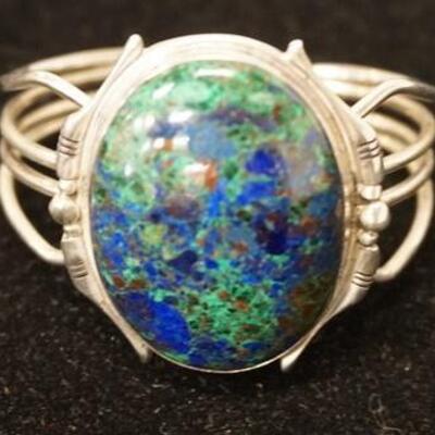 1009	STERLING SILVER BRACELET W/ BLUE/GREEN STONE WEIGHT INCLUDING STONE IS 1.49 TROY OUNCES 
