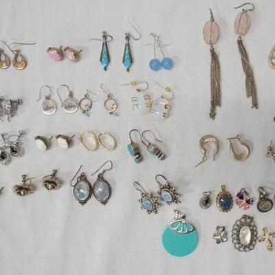 1014	LOT OF 24 PAIRS OF STERLING SILVER EARRINGS AND 12 PENDANTS LOT ALSO INCLUDES ONE SMALL STUDENT COUNCIL PIN COMBINED WEIGHT OF ALL...