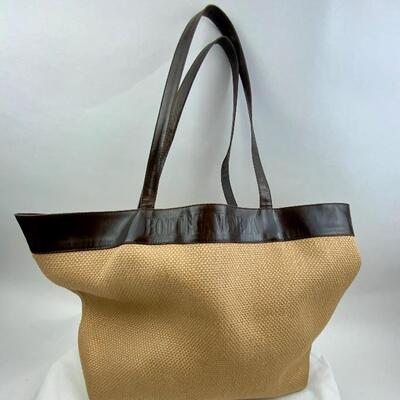 This Bottega Veneta Woven Straw w/Leather Trim bag  is available for purchase at https://scavengersparadiseestatesales.com    