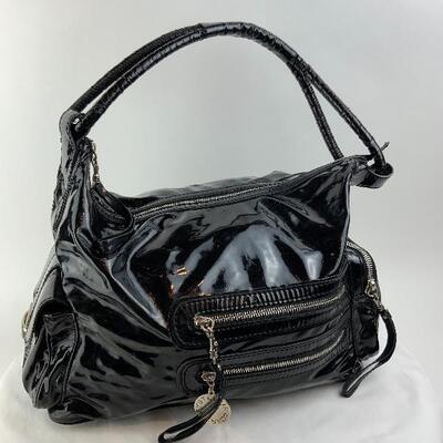 This Stella McCartney Black Patent Leather bag is available for purchase on https://scavengersparadiseestatesales.com    