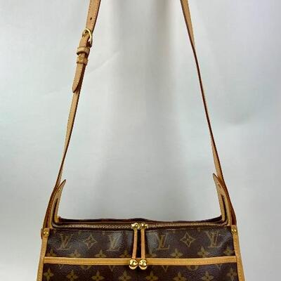 This Louis Vuitton Triangle Crossover bag  is available for purchase at https://scavengersparadiseestatesales.com    