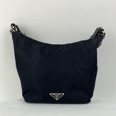This Navy Prada Nylon & Leather Shoulder bag is available for purchase at https://scavengersparadiseestatesales.com    