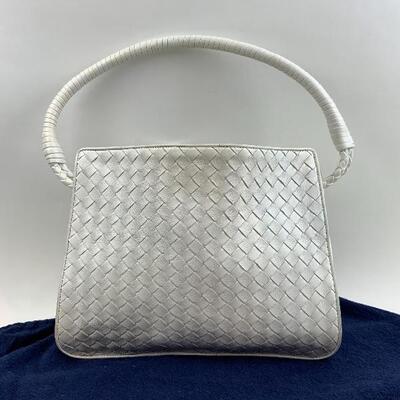 This White Woven Leather Bottega Veneta bag is available for purchase on https://scavengersparadiseestatesales.com    