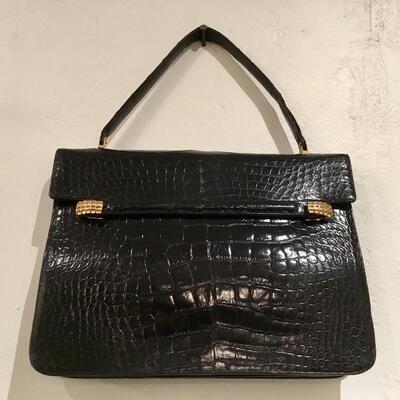 This Vintage Rendl Alligator Purse is available for purchase at https://scavengersparadiseestatesales.com    