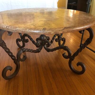 solid metal table with marble top