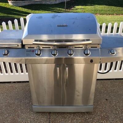 Infrared Propane Grill with Side Table, Burner, and Cabinet below.