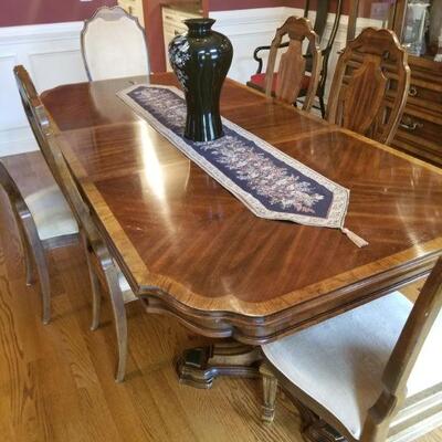 Inlaid wood. Some minor scratches. Table with 6 Chairs and leaf $600