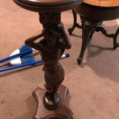 carved woman statue holder