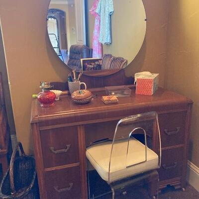 Antique vanity with lucite swivel chair
