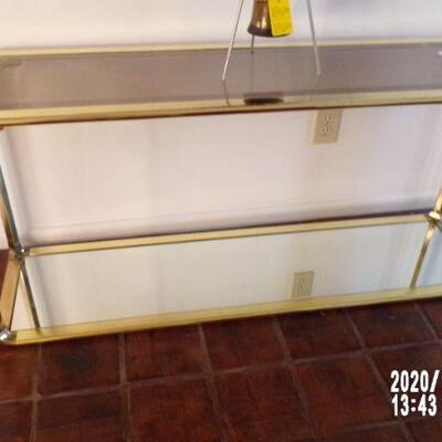 Brass and glass sofa table with mirror base