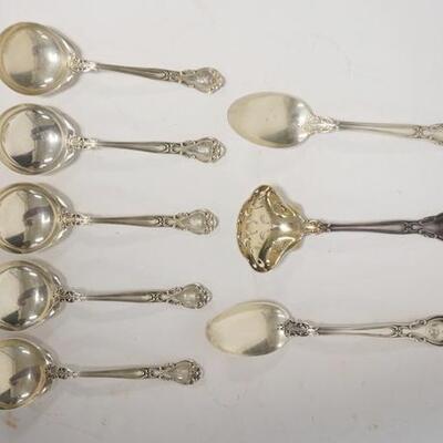 1012	GROUP OF 8 MATCHING STERLING SILVER SPOONS, INCLUDES A GOLD WASHED SLOTTED LADLE, PATENT 1895, TEASPOONS 5 3/4 IN, 5.865 TROY OZ	100...