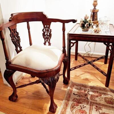 One of a pair of Sword Chairs and one of a pair of mahogany chippendale end tables with beveled glass top