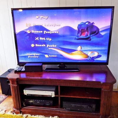 60 In LG flatscreen TV with remote and nice entertainment center