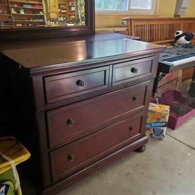 Nice new dresser with mirror and the smalle chest in front is A.TV cabinet . Front panel opens