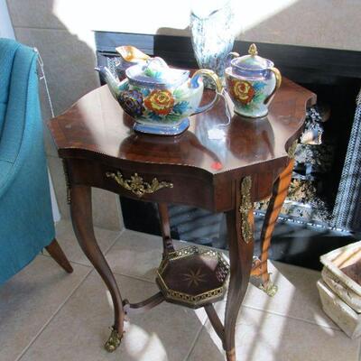 Elegant inlaid wooden table with brass accents