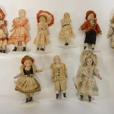 1073	GROUP OF MINIATURE ANTIQUE BISQUE HEAD DOLLS, TALLEST IS APPROXIMATELY 4 IN HIGH	50	100	25	PLEASE PAY ATTENTION FOR DAILY ADDITIONS...