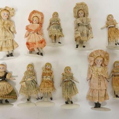 1074	GROUP OF 11 MINIATURE ANTIQUE BISQUE HEAD DOLLS, TALLEST IS APPROXIMATELY 5 IN HIGH	50	100	25	PLEASE PAY ATTENTION FOR DAILY...
