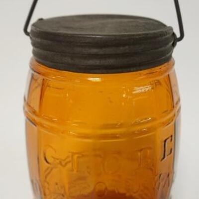 1012	GLOBE TOBACCO CO AMBER BARRELL JAR, 7 1/4 IN EXCLUDING HANDLE, HAS A MANUFACTURER DEFECT & SMALL RIM CHIPS	70	150	25	PLEASE PAY...