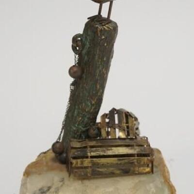 1040	SIGNED ROSS METAL SCULTPOR OF A SHORE BIRD MOUNTED ON A STONE BASE. BIRD IS SITTING ON A POST W/ LOBSTER TRAPS BENEATH. 8 1/2 IN H...