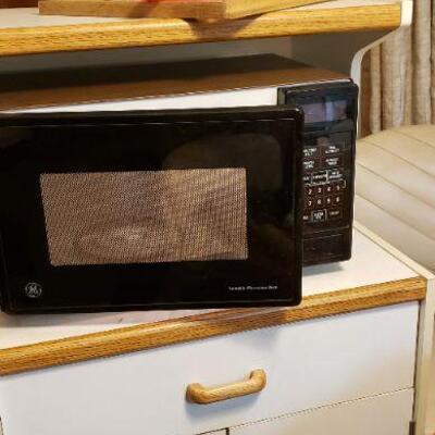 GE microwave in white cabinet (cabinet sold)