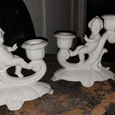 white porcelain cherub candle holders