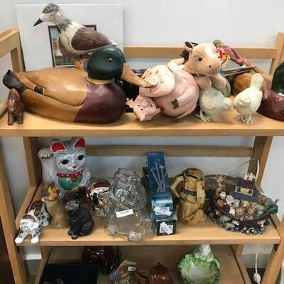 Collection of duck decoys and other decorative items.