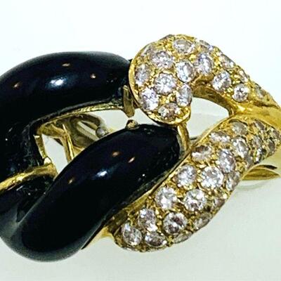 Vintage 18kt gold diamond & onyx fashion ring. The ring features a total of fifty-five (55), pave set, round brilliant cut diamonds (one...