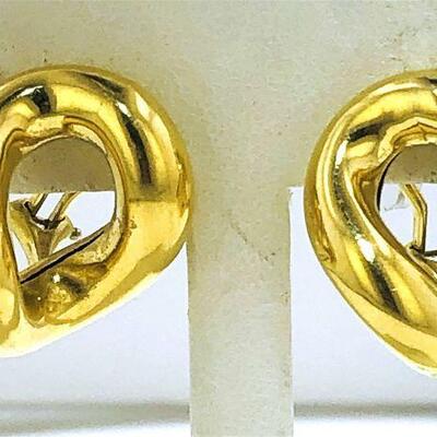 Pair of 18kt gold curved tube style earrings. The earrings have an open design and measure approx. 27.00 x 21.90mm wide, have omega clip...