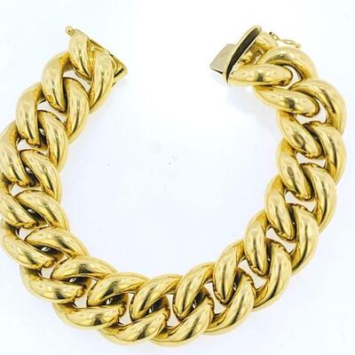 18kt gold traditional curb link bracelet. The bracelet measures approx. 8.50