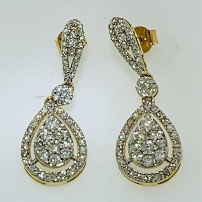 Pair of 14kt gold diamond fashion earrings. The earrings have a dangle design measuring approx. 1.25