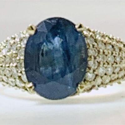 One 14kt gold sapphire & diamond ring. The ring features one (1), four prong set, oval faceted blue sapphire set in the center surrounded...