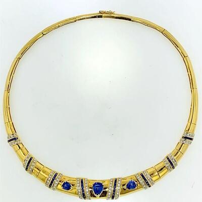 One 18kt gold sapphire & diamond hinged omega style 17.00
